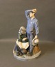 Large porcelain figurine, Man with Scythe and wife by Royal Copenhagen.5000m2 showroom.