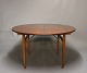 Round dining table with extensions in teak and oak by Hans J. Wegner from the 1960s.5000m2 showroom.