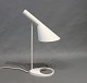 Arne Jacobsen, white tablelamp, designed in 1960 and manufactured by Louis Poulsen.5000m2 showroom.