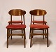 A set of four dining room chairs in teak and upholstered with red fabric, of danish design from the 1960s.5000m2 showroom.